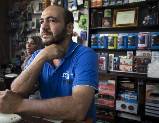 Worker in his store