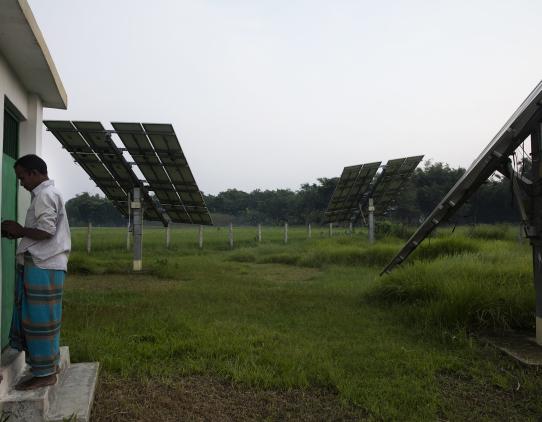 Person entering a building with solar cells