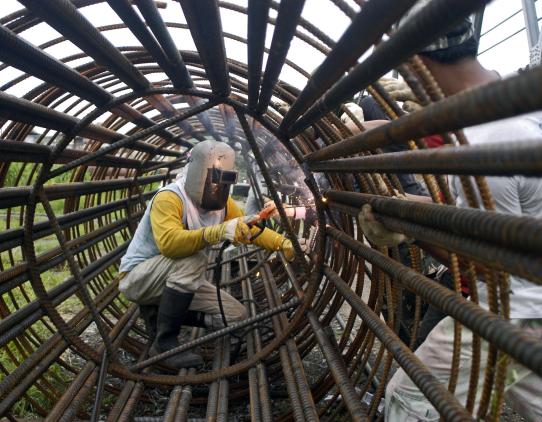 Worker using protective gear